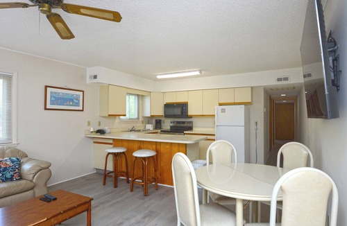 Caine Woods Condo | Quaint, but pristine 2-bedroom condo with free WiFi and an outdoor pool located uptown on the bayside in a peaceful, family-friendly neighborhood!
