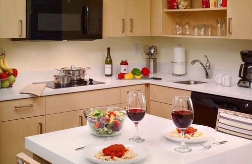 Somerset Hotel | Relax in Spacious Suite with Full Kitchen and Seasonal Swimming Pool