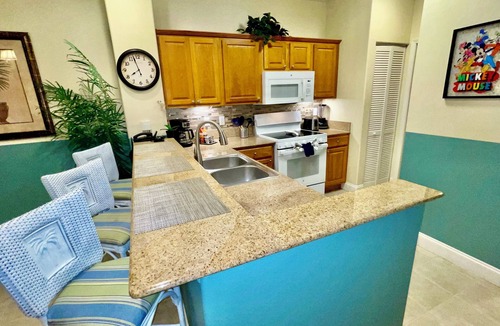 Florida Central Atlantic Coast Condo | Serene Oasis Lakefront Penthouse Facing Disney