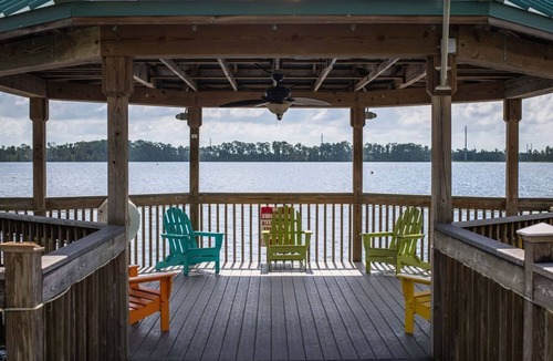 Florida Central Atlantic Coast Condo | Serene Oasis Lakefront Penthouse Facing Disney