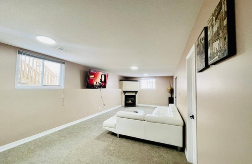 Amherstview House | Spacious Hearth Escape with Natural Light & fireplace