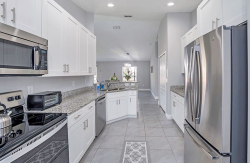 Poinciana House | THE MODERN OASIS - SPACIOUS 4 BDRM VACATION HOME. MINS. FROM DISNEY.