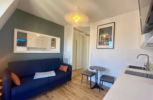 Champs-Elysees Apartment | Top floor Paris studio - view of rooftops and monuments