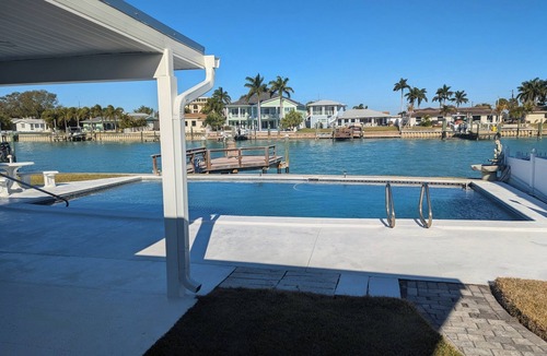 Capri Isle House | Treasure Island Beach Waterfront Pool and Dock Home