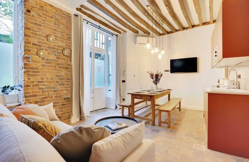 Quartier Sainte-Avoye Apartment | Truly Marais !Set in a passage flowered setting with beautiful colored windows.
