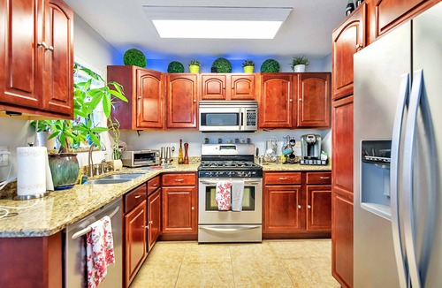 Tropic House | Urban Oasis W/hot Tub, Heated Pool And Private Movie Theater 2 Bedroom Home by RedAwning