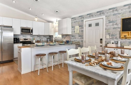 Caine Woods Villa | Walk to the Beach! Firepit, Fully Fenced Yard, Grill, Bikes, N64, Pets/EV!