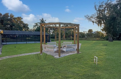 Tropic House | Waterfront Beauty: Sleeps 15, Heated Pool, Private Dock, Near Beach