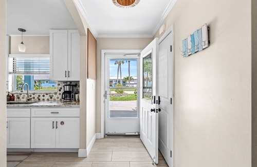 Convair Cove House | Waterfront Home with Heated Pool & Spa | Dock | 4.5 Blocks to Beach & Downtown