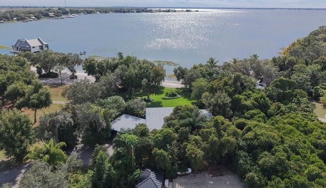A welcoming lakefront home on a beautiful private beach and long range lake view