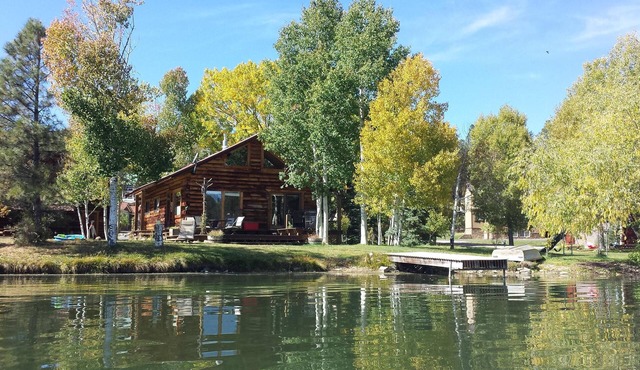 Authentic lakefront log cabin with mountian views. Ice off! Come fishing!