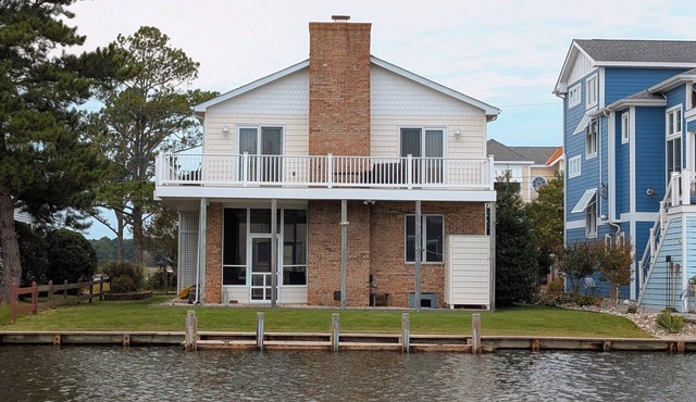Canalfront Retreat w/Dock, Kayaks & Screened Porch – Pet-Friendly!