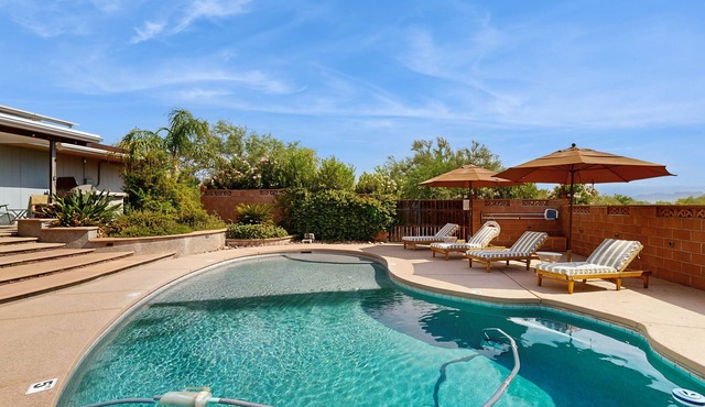 Dog-friendly modern stay with a heated private pool, sun room, & grill