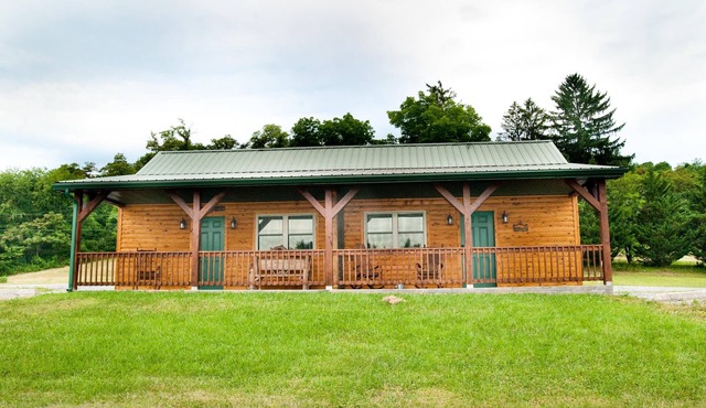 Double cabin with 2 queen beds, 1 king bed, common porch and each unit has a private entrance and bath.
