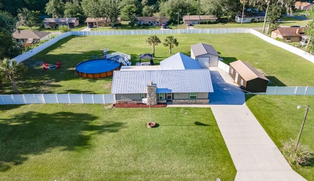Fenced yard retreat w/pool & game room