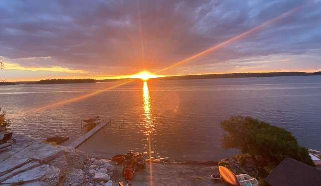 Lake side Chateau and Coach House with private beach and Hot Tubs.