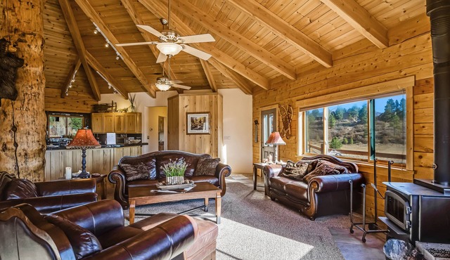 Large family-friendly cabin with game room, hot tub, & wraparound deck