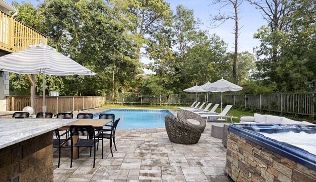 Re-modernized home with heated saltwater pool, home office, gym, electric.