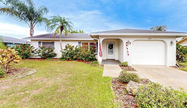 Single-story home with private yard, enclosed patio, updated interior, & WD