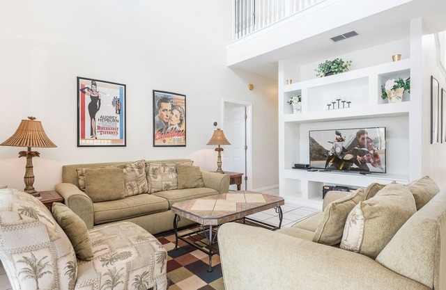 Luxury Sunset Lakes Lakeview home - with two masters, hot tub and games room.
