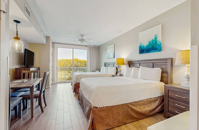 Renovated studio with pool, hot tub, full sized fridge, and 2 burner stovetop