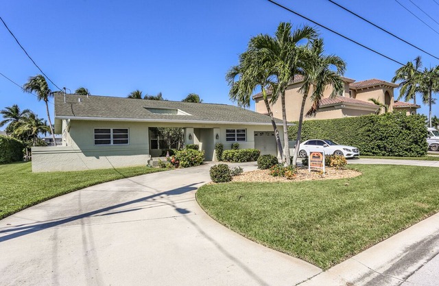 This lovely vacation home with its lush and beautifully manicured landscaping is located on the mainland of Fort Myers Beach, at 18116 Cutlass Drive.