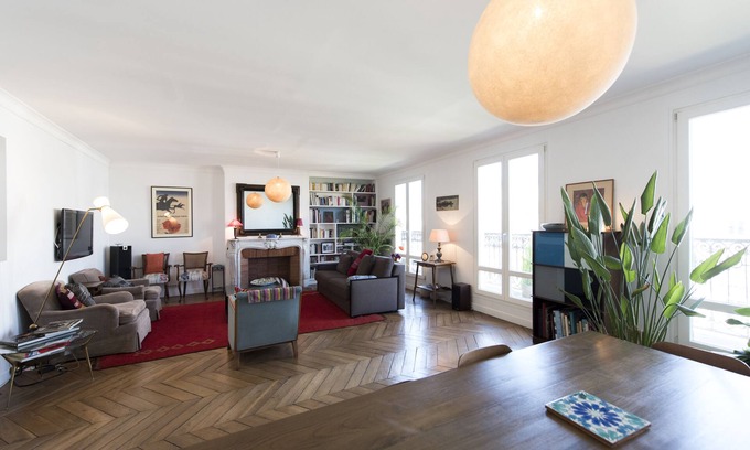 Saint-Vincent-de-Paul Apartment | Balcony Over The Tree-Lined Boulevard, by Veeve