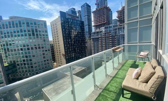 Wellington Place Apartment | Beautiful Condo with Gym, Rooftop Pool + Private Patio!