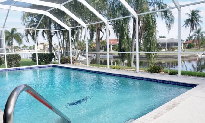 Punta Gorda House | Canal home, best view, sunrise and sunset, huge HEATED salt pool, large dock
