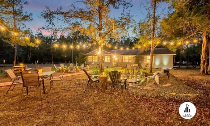 Eustis House | Uhost AI - 4BR Getaway - Cozy Firepit & Hot Tub Fun