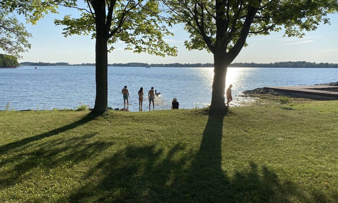 Wolfe Island Cottage | Waterfront, sunlit cozy cottage with large dock, fire pit and good swimming.
