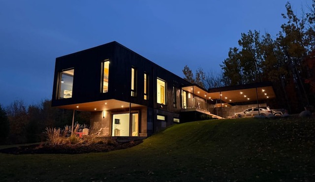 Stunning Modern Architectural Home on 5 acres of forest with hilltop lake views